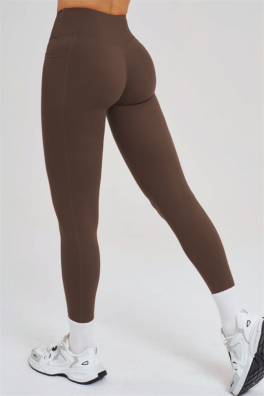 Taupe high-rise leggings, full-length with sculpted seams at the thighs