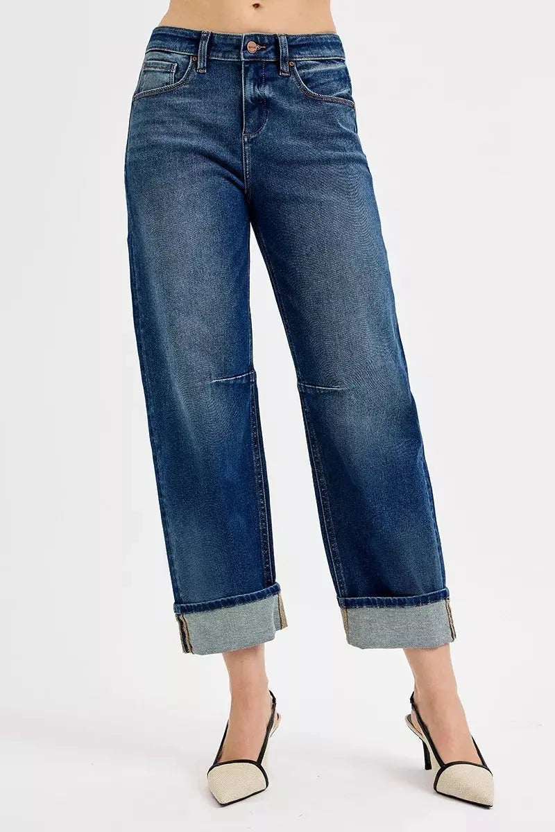 Dark wash slouchy crop jeans with cuffed hem, button fly, and front seam detailing