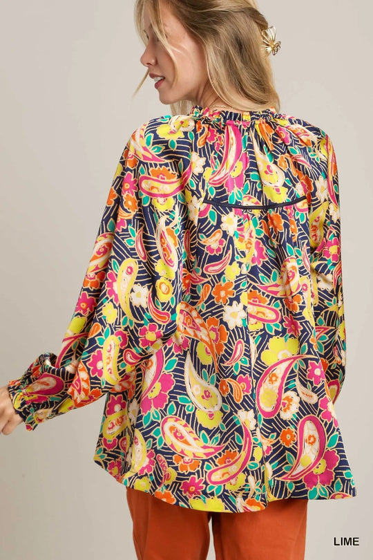 Back view: multicolor paisley satin shirt with ruffle-trim neckline and long sleeves