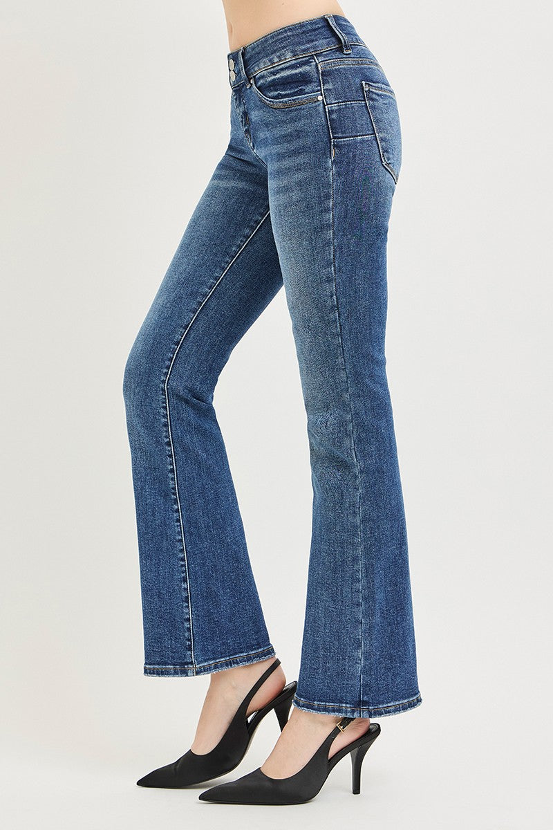 Medium wash low-rise bootcut jeans, dark topstitching and belt loops (side view)