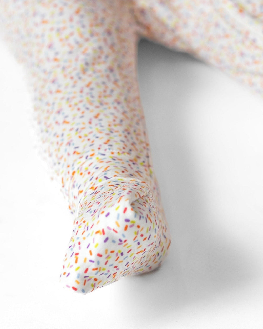 Bamboo romper pajama legs with multicolor confetti dots, close-up cuff and ankle