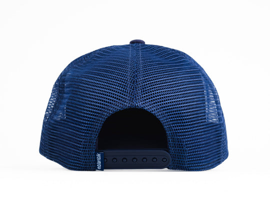 Swell Cap Blue: navy mesh trucker cap with adjustable snapback band at back.