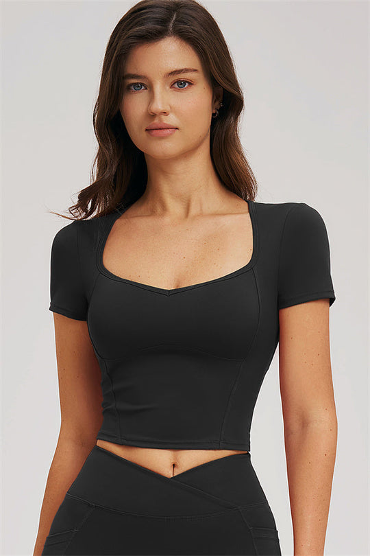 Black fitted crop top and high-rise leggings set, close front view