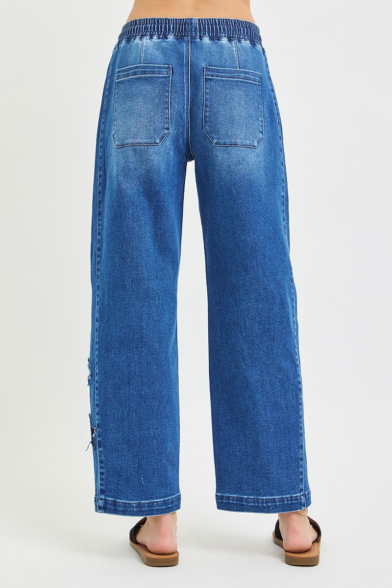 Dark denim cropped barrel jeans with elastic waist and drawstring, back patch pockets