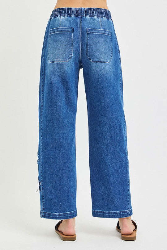 Dark denim cropped barrel jeans with elastic waist and drawstring, back patch pockets