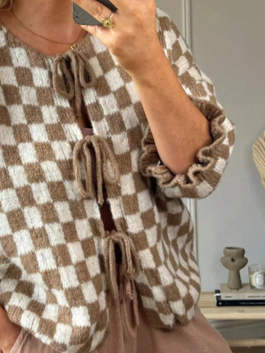 Tan and white checked tie-front knit cardigan, vertical tie details and frilled sleeve cuffs