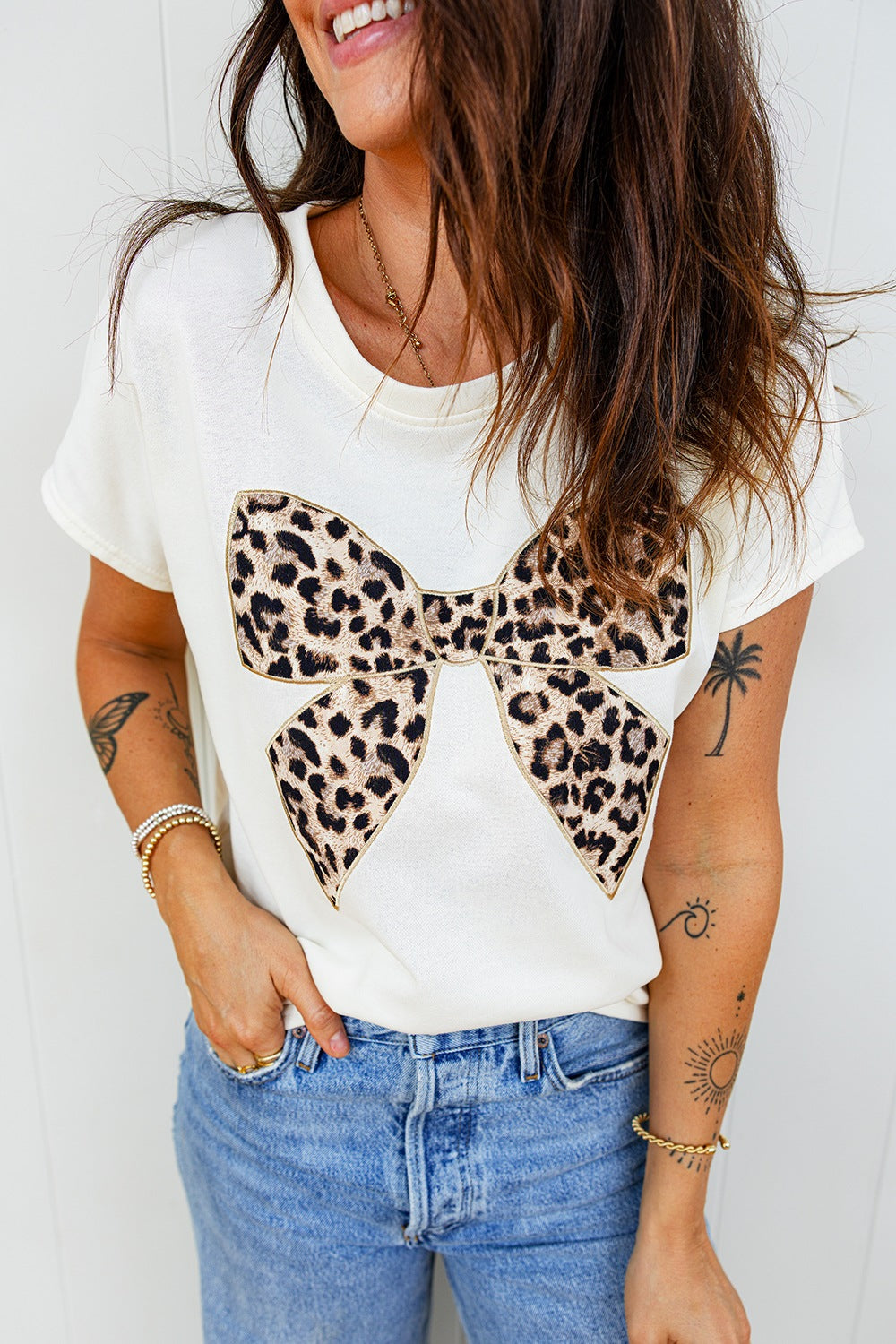 White relaxed fit T-shirt with leopard bow graphic on front