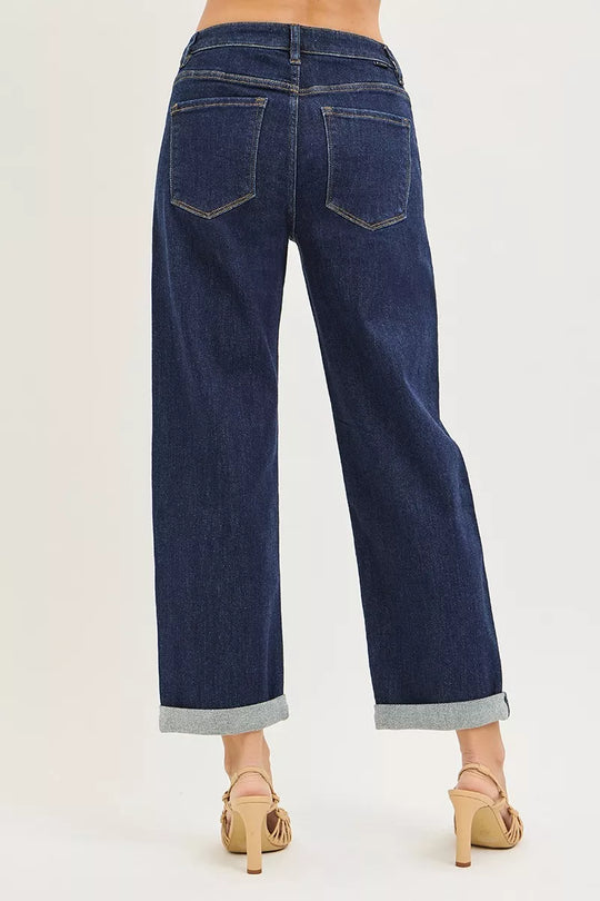 Dark blue boyfriend jeans back view with two patch pockets and cuffed hem