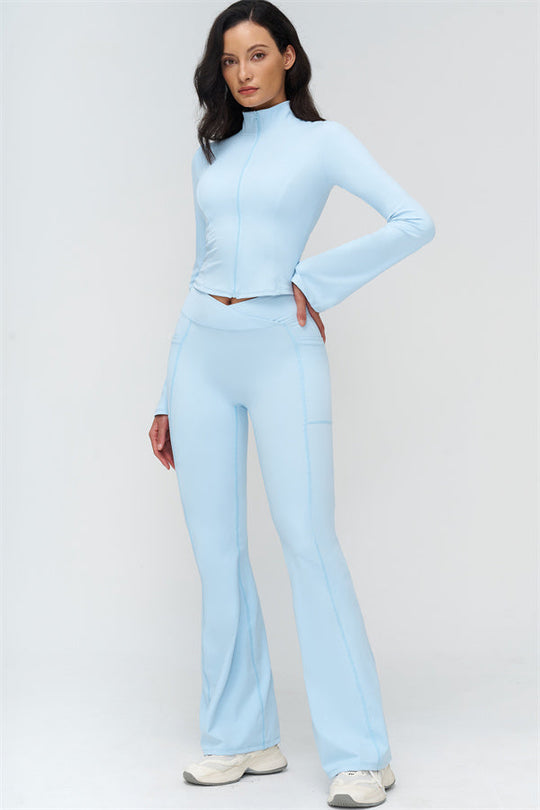 Light blue zip-up athletic jacket with high collar and flared leggings set