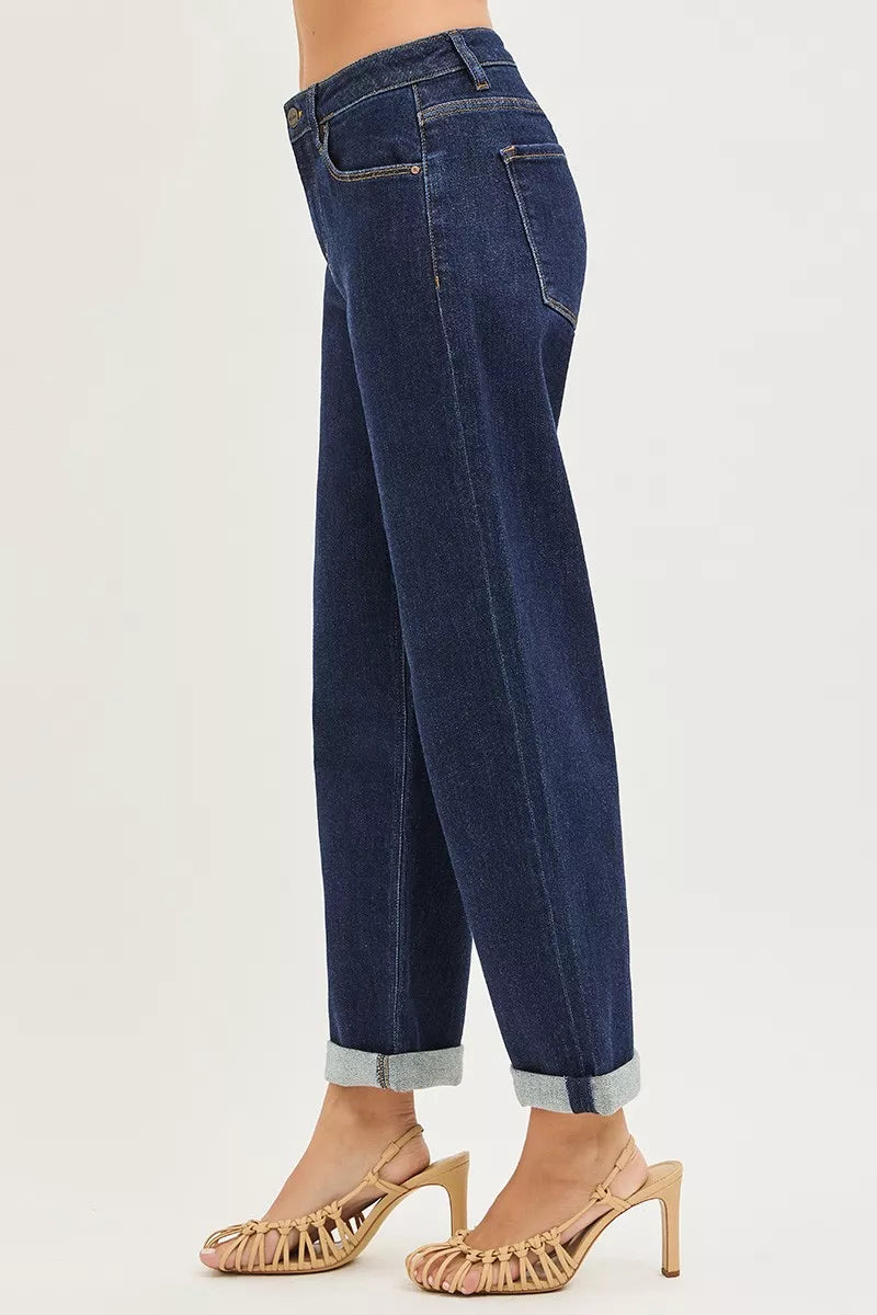 Dark blue jeans, side view—slouchy cropped cut with cuffed ankle hem