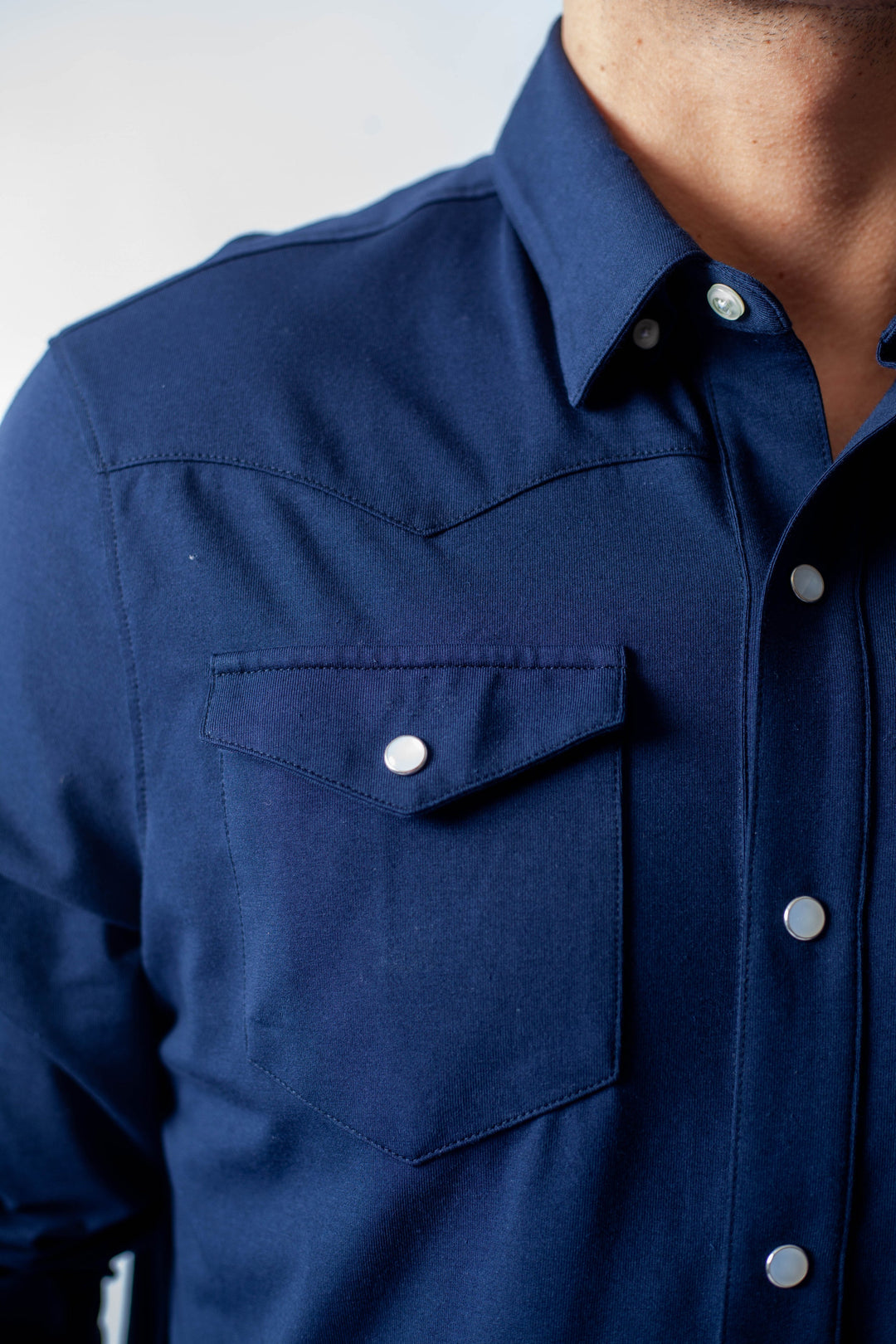Navy Western tech shirt shoulder and chest pocket with snap-style buttons