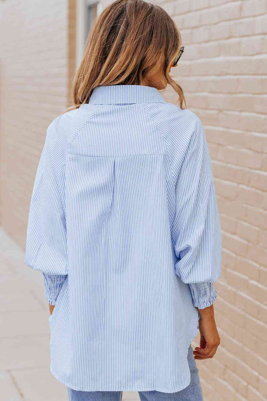 Pastel blue back view of lantern sleeve shirt with yoke and center pleat