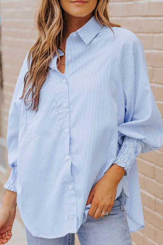 Pastel blue striped lantern sleeve shirt, button-down front and draped hem