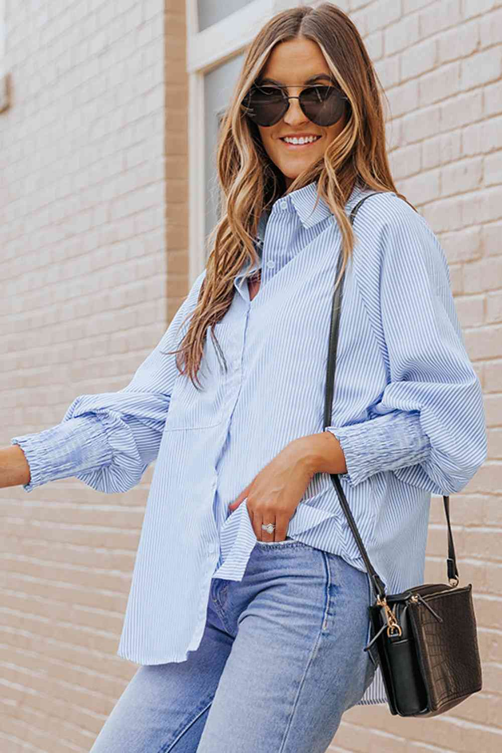 Pastel blue striped button-up shirt with lantern sleeves and chest pocket