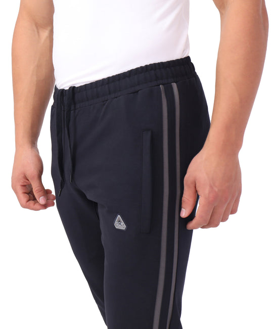 Flex jogger sweatpants waistband and pocket close-up, dark fabric with side stripe detail