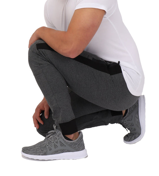 Dark grey/black jogger pants, side stripe detail near knee and cuffed ankle