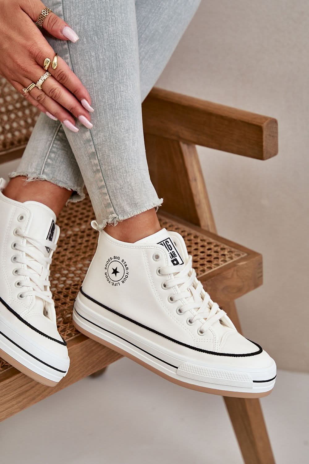 White high-top sneakers with lace-up closure and “Big Star” logo patch on side.