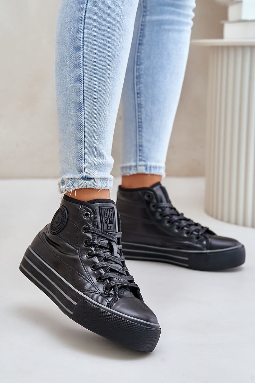 Black high-top platform sneakers, side stripe detail and lace-up closure