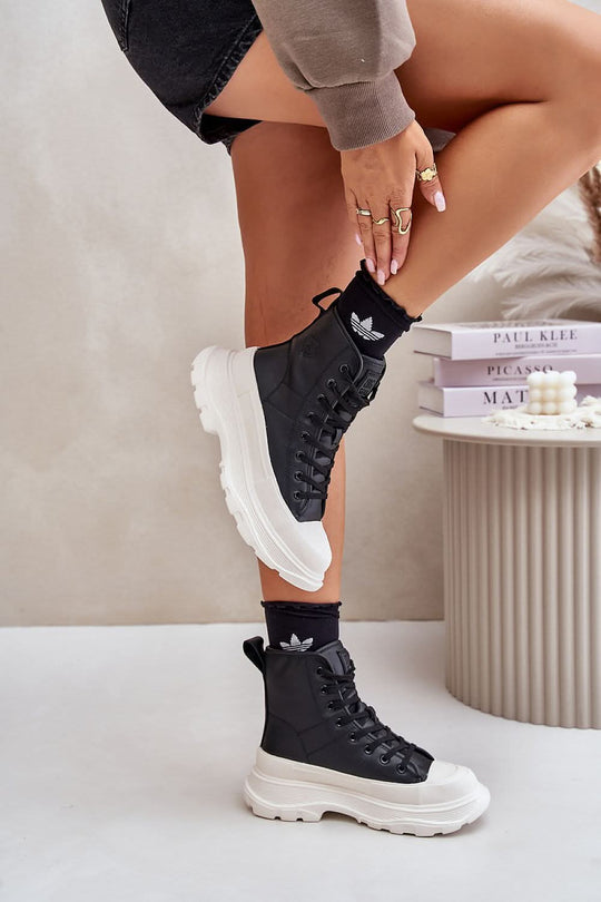 Black high-top natural leather sneakers, white chunky sole, lace-up logo