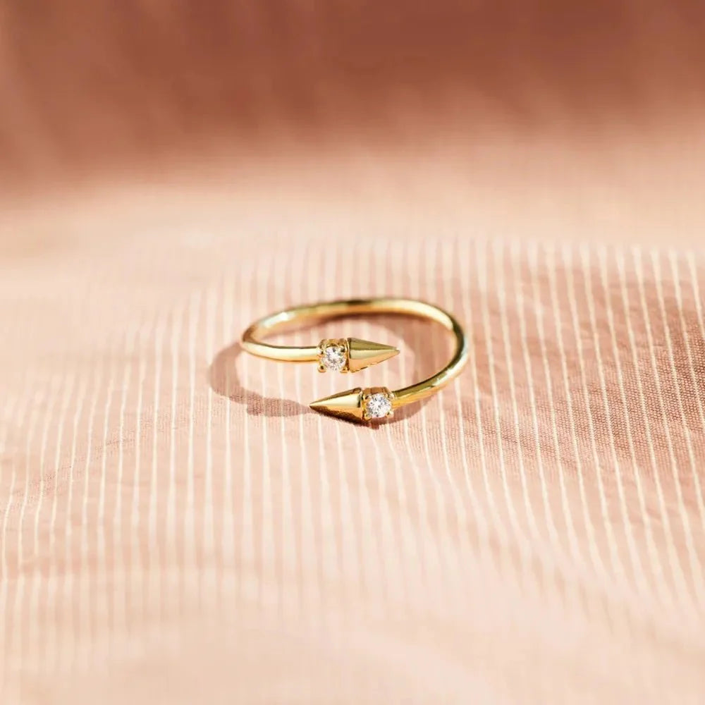 Gold Arrowlight Ring front view with two arrow tips and center round crystal