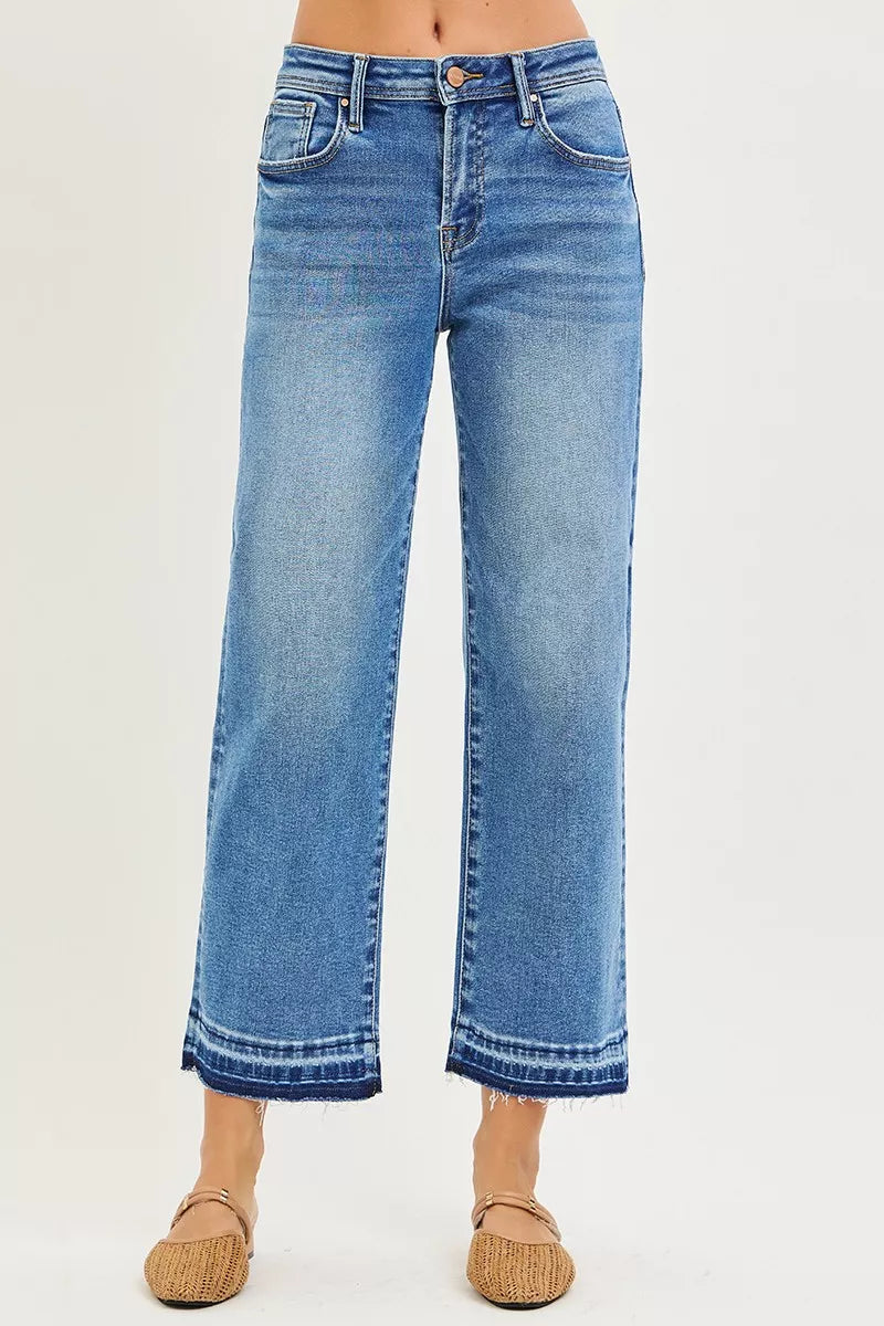 Medium wash slouchy cropped boyfriend jeans, high-rise waist, button fly