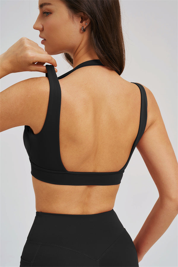 Black sports bra back view with open panel styling
