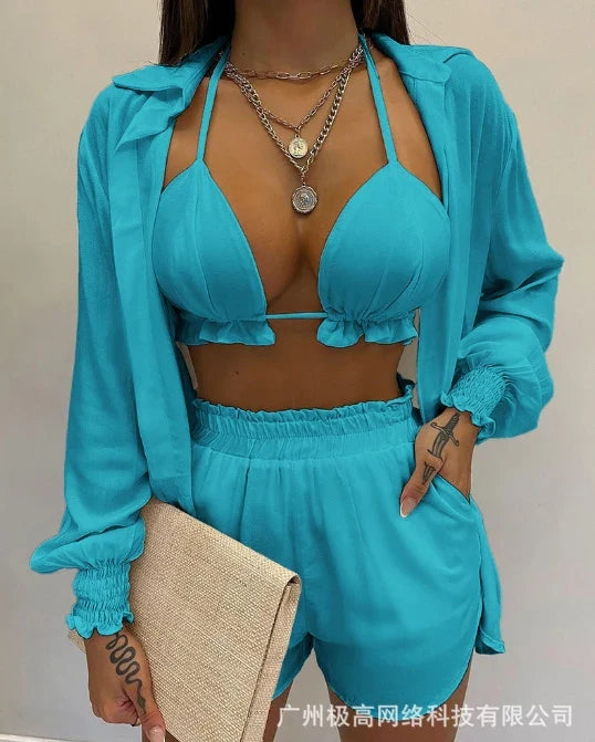Teal lantern-sleeve shirt and shorts set with ruffled edges and exposed midriff triangle top