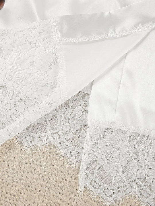 White lace-panel cardigan detail over smooth fabric