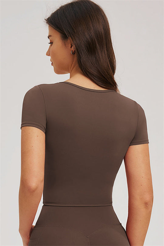 Taupe back view of fitted t-shirt top with matching high-rise leggings