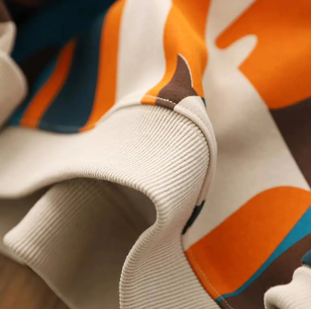 Beige boys hoodie with ribbed cuffs and hood, orange and blue cartoon cat print