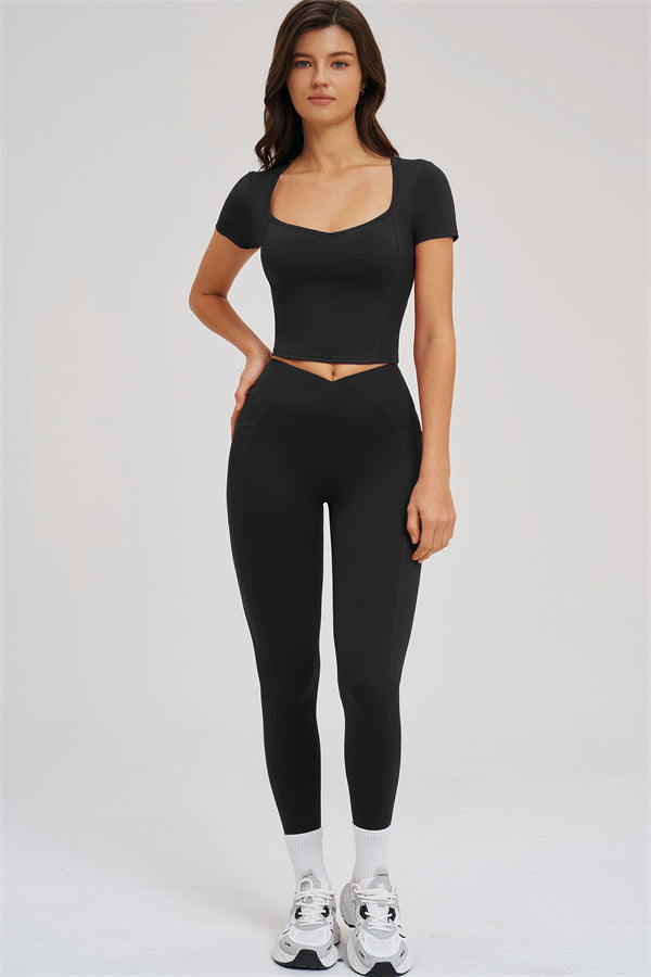Black 2-piece set: cropped tee and high-rise leggings with white ankle bands