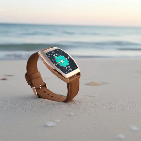 Mil-e smartwatch angled view with tan leather strap and green four-leaf clover dial
