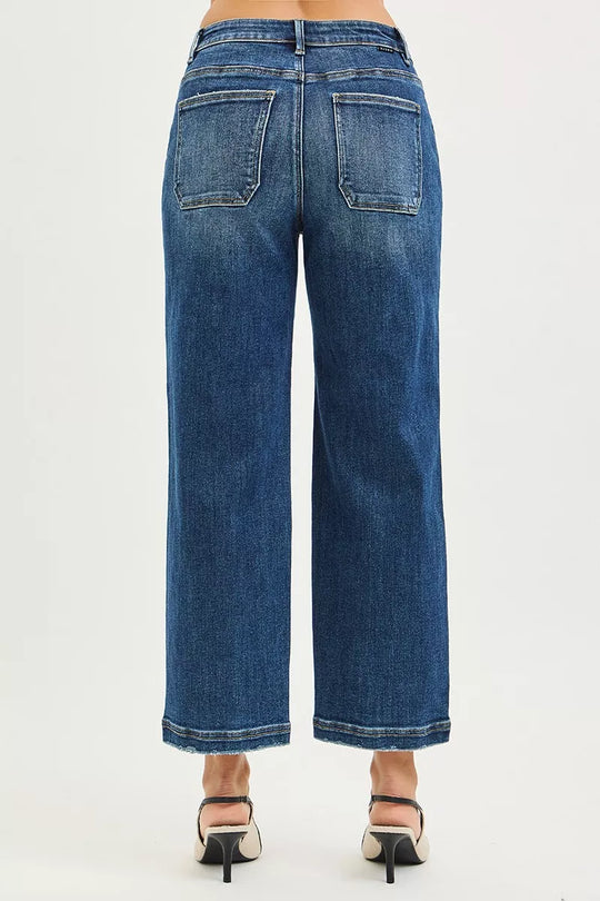 Dark blue cropped baggy jeans with rear patch pockets and relaxed straight legs