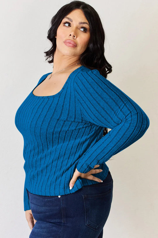 Sky blue ribbed long-sleeve T-shirt, fitted knit with wide shoulder drape