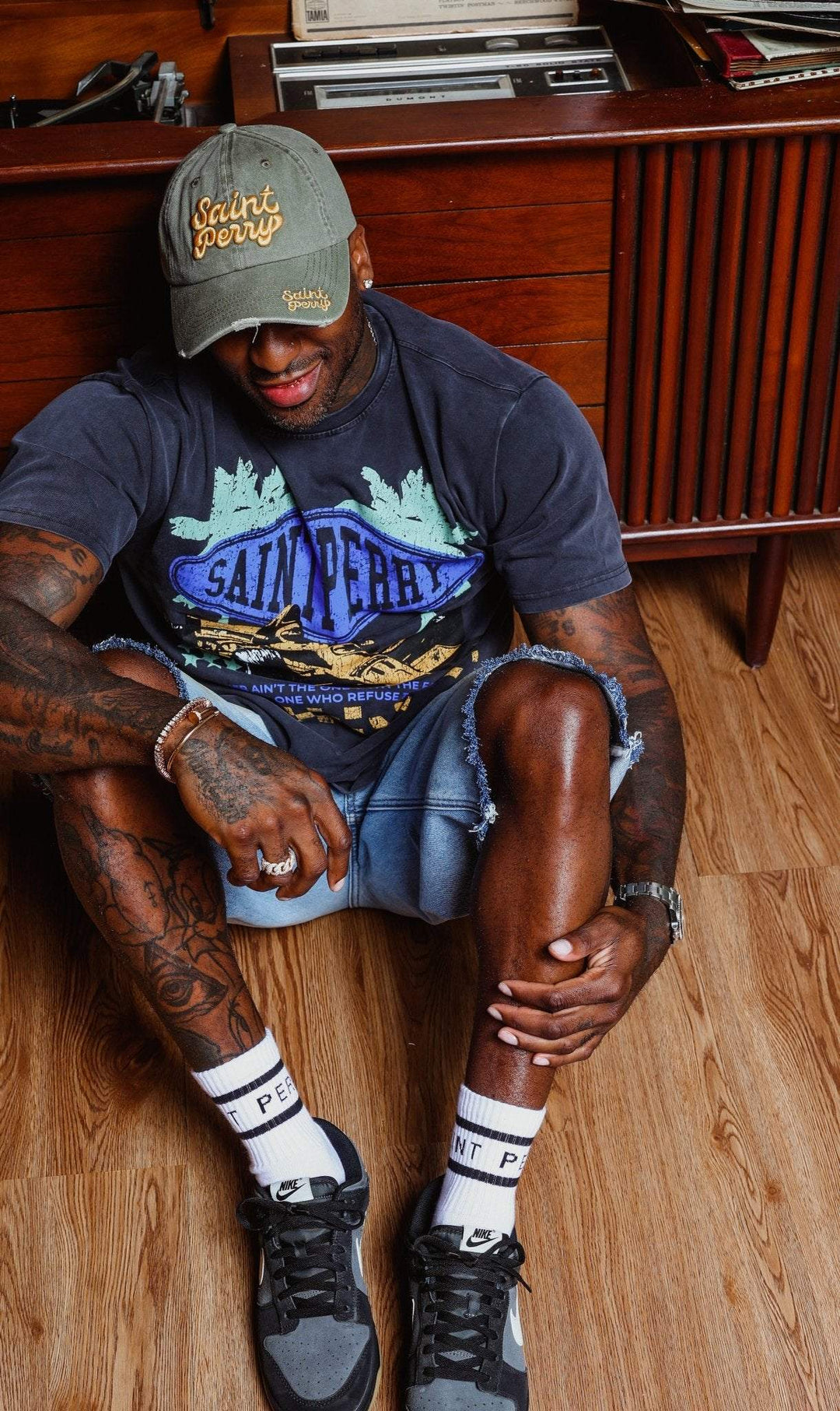 Relaxed light blue denim shorts, worn spots, straight hem, front pockets visible