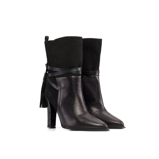 Black high-heel booties with cross ankle strap and side tassel