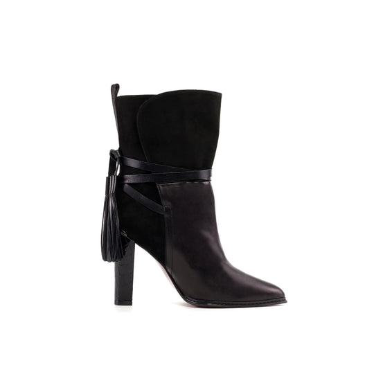 Black high-heel booties with ankle strap and tassel detail, pointed toe