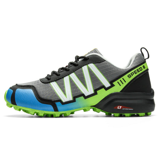 Trail running shoe: dark gray upper with neon green and blue accents, rugged sole.