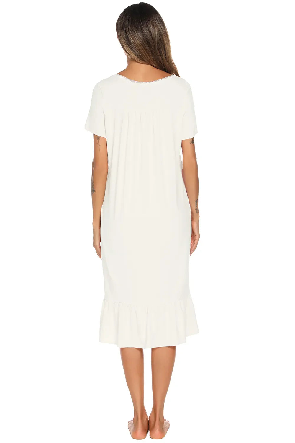 White lounge dress back view with short sleeves and ruffled lower hem