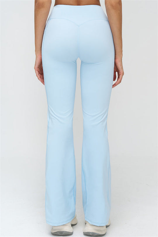 Hellblaue Schlagleggings, hinten: hohe Taille und weich fallendes ausgestelltes Bein