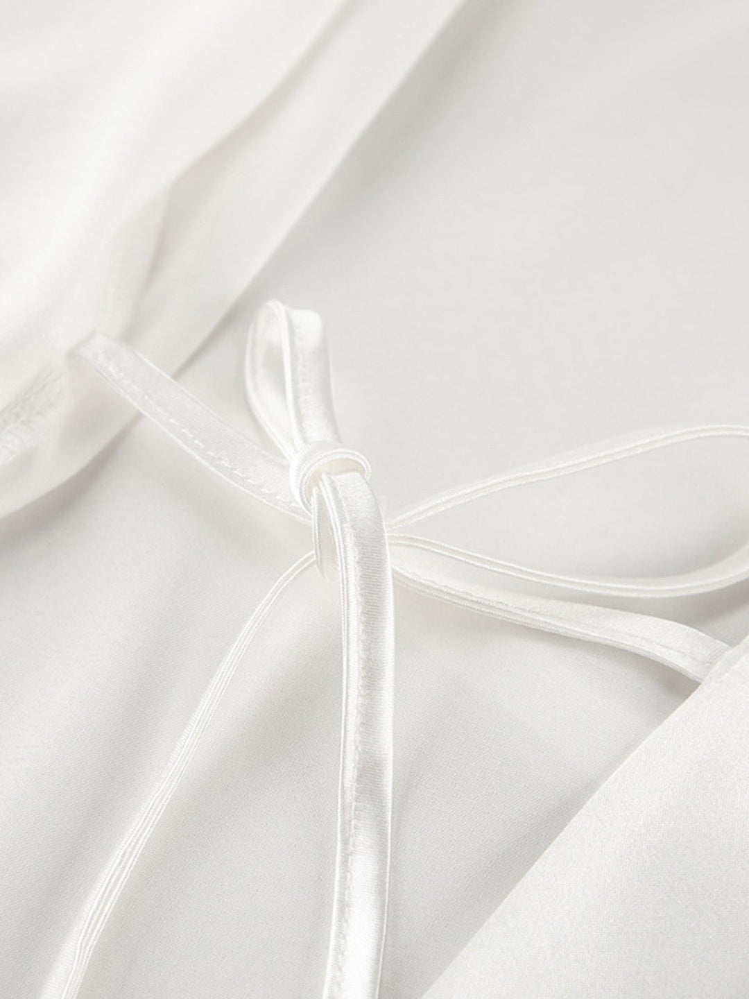 White camisole top with lace-trim shoulder straps