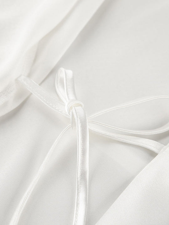 White camisole top with lace-trim shoulder straps