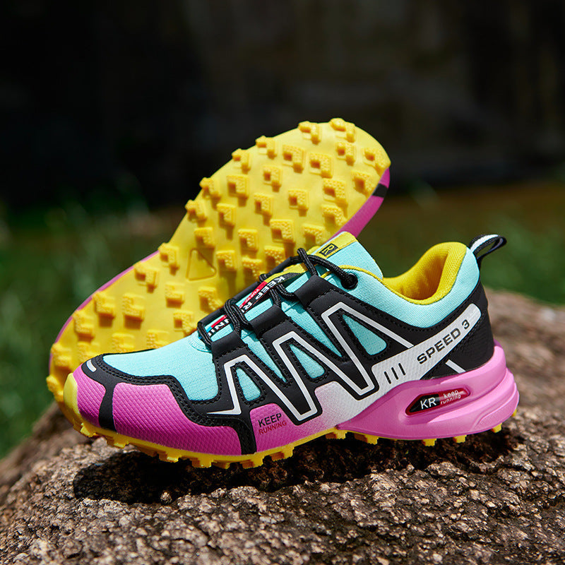 Off-road running shoe: light blue upper with purple trim, yellow knobby outsole.