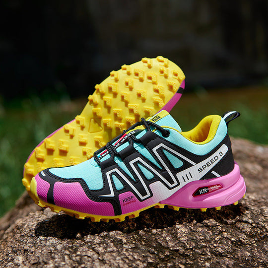Off-road running shoe: light blue upper with purple trim, yellow knobby outsole.
