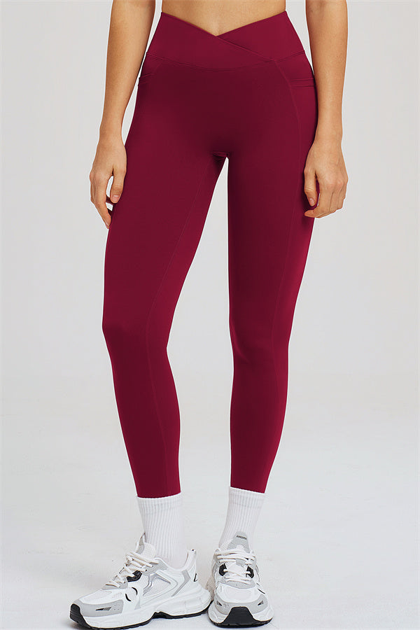 Burgundy high-waist leggings with sculpted seams, front view