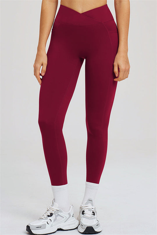 Burgundy high-waist leggings with sculpted seams, front view