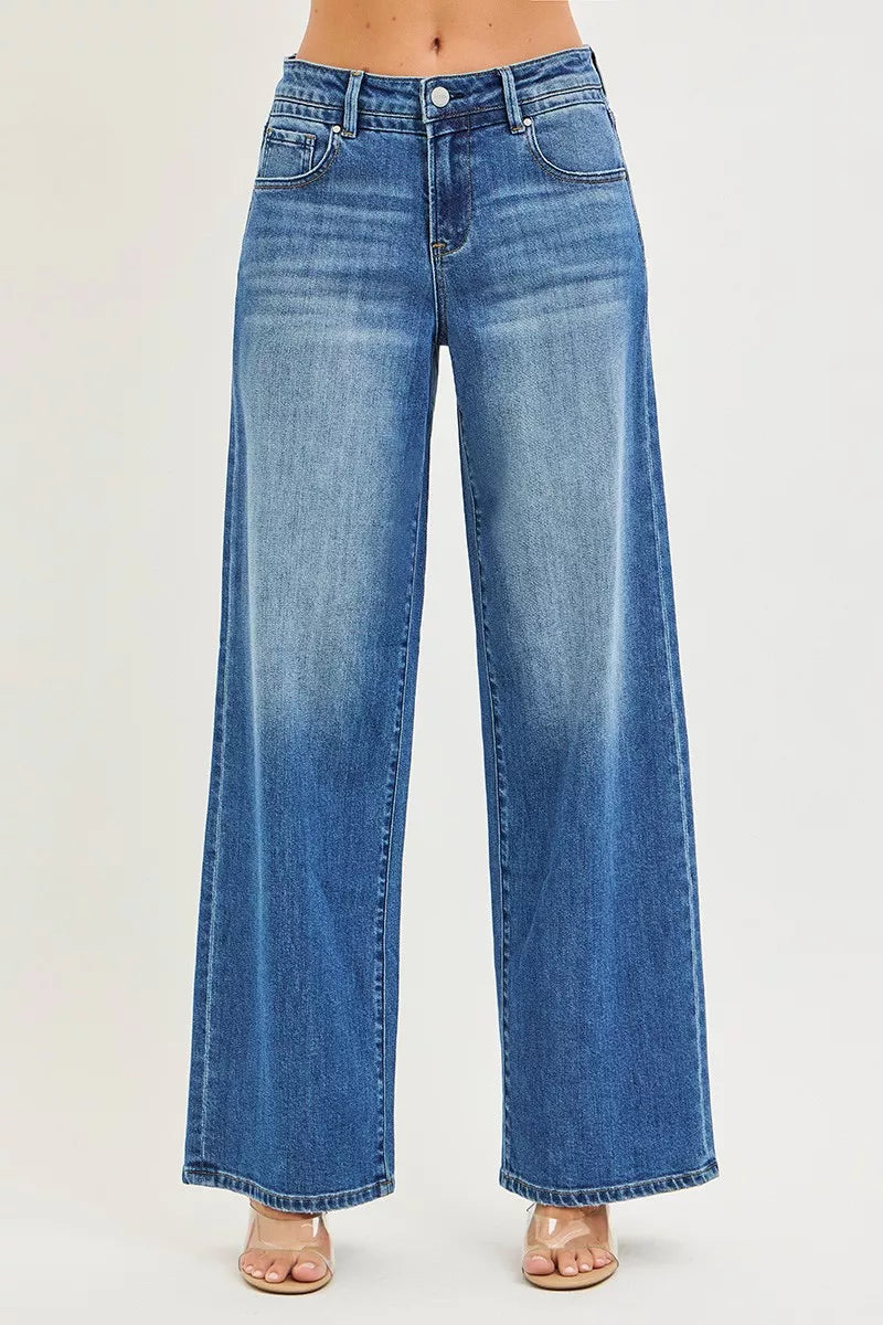 Medium-wash high-rise baggy jeans with front pockets and relaxed straight legs