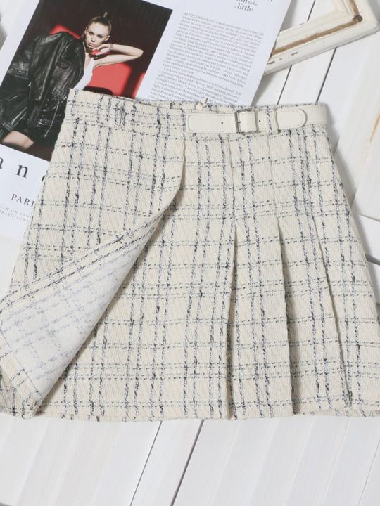 Pleated plaid mini skirt in beige with blue grid lines and stitched front pleats