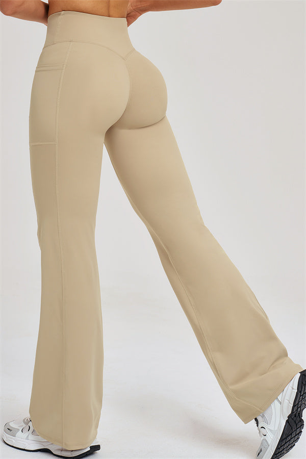 Almond flared leggings with high-rise waistband and stitched seams on the legs