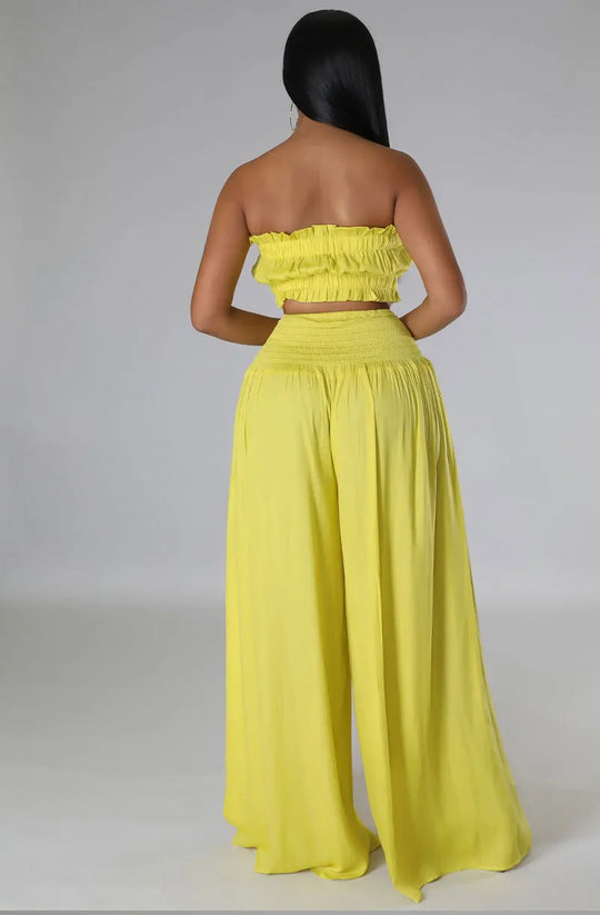 Lime yellow 2-piece set, back view: strapless smocked crop top with wide-leg maxi pants